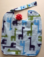 Bavoir réversible motif girafes