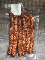 Saucisses épicées de porc noir