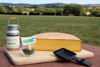 Fromage à raclette 1/2 de meule ail des ours